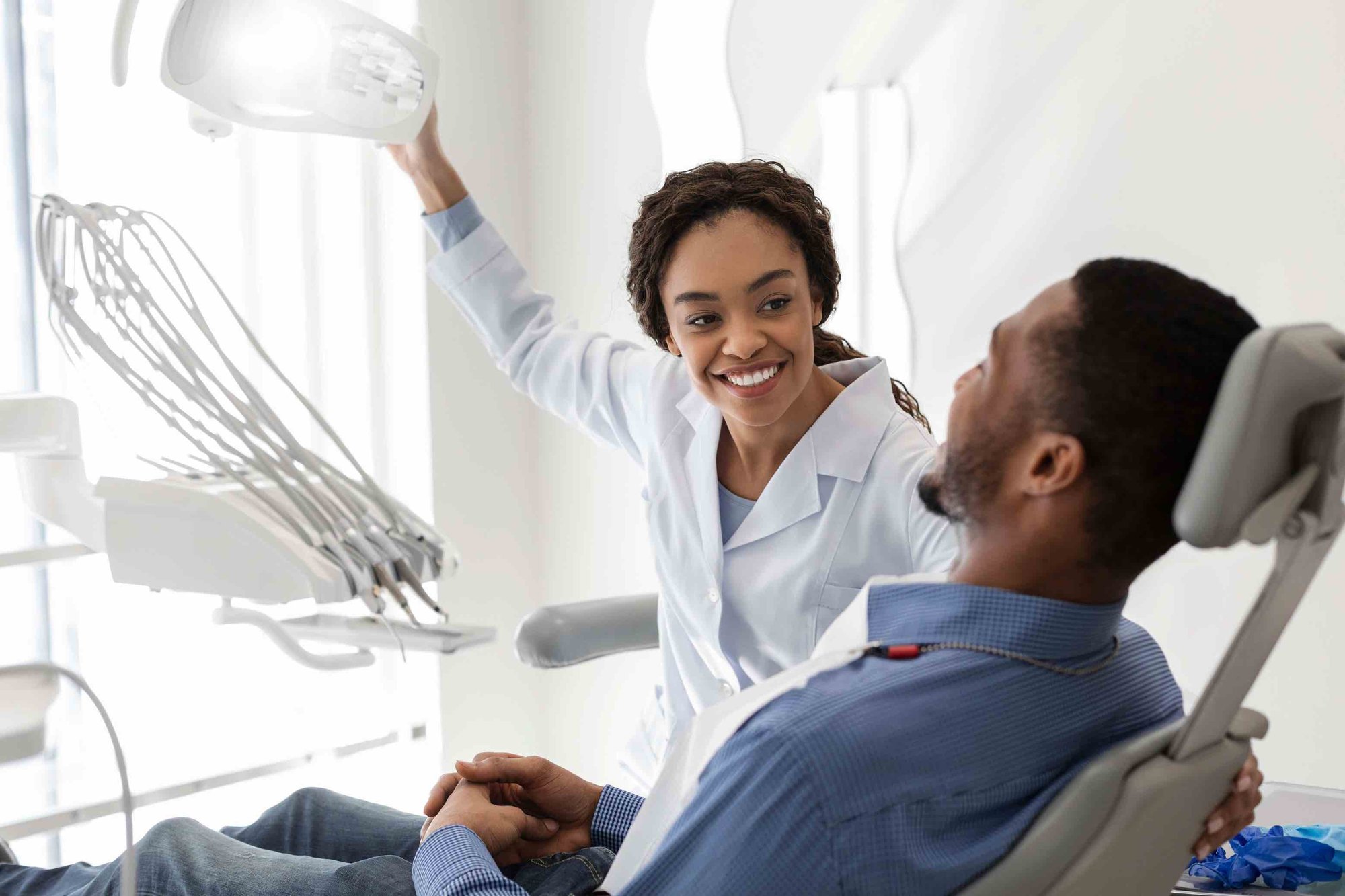 Copy of 145575334_black_female_dentist_with_male_patient