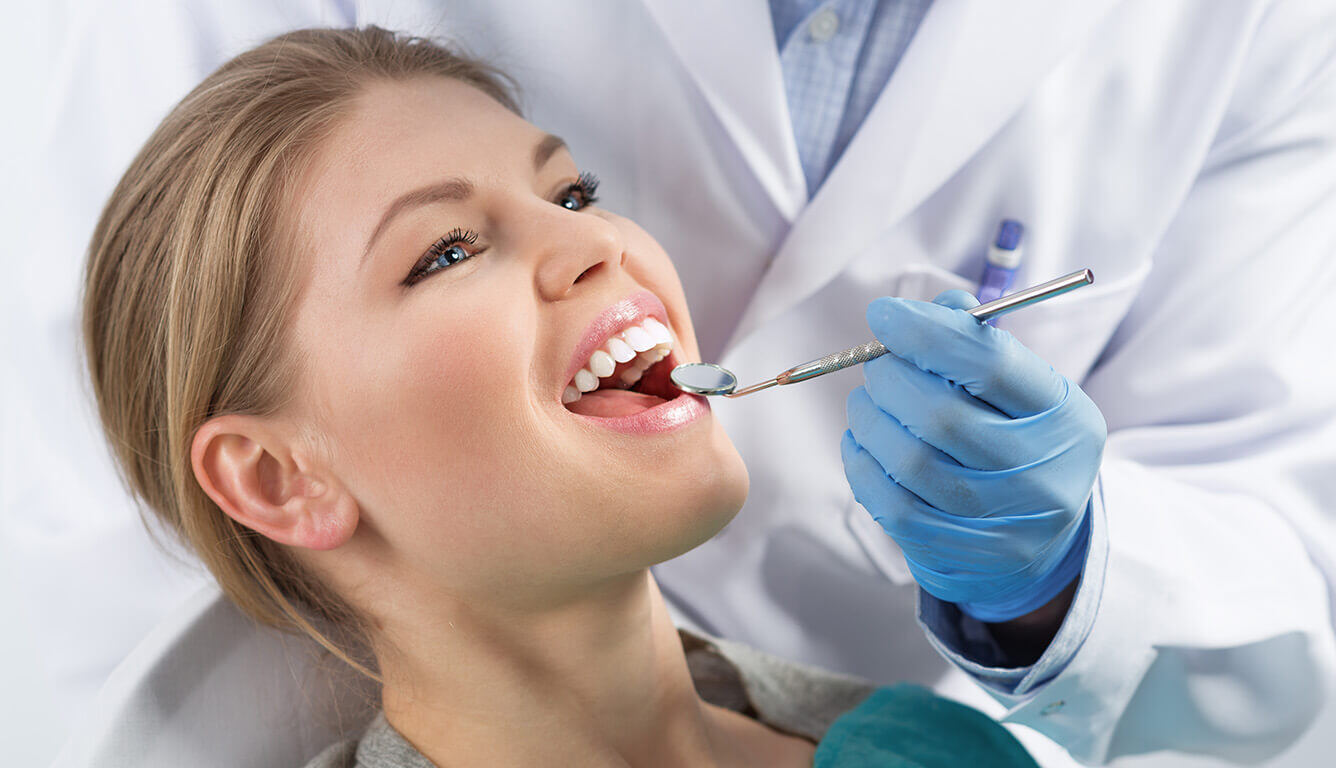 Woman getting dental exam