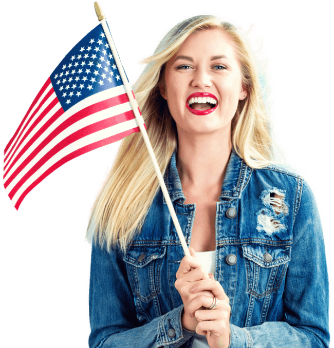 Woman smiling and holding a United States flag
