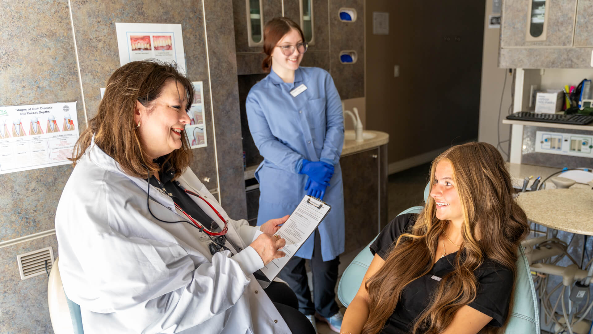 dental-care-team-photo-helping-patient_Gentle-Dental-Grand-Central